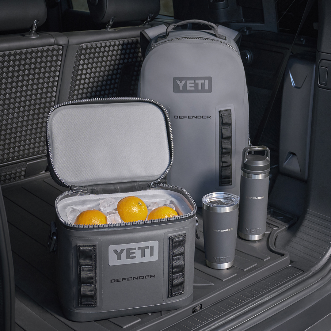 YETI cool bag, backpack and thermos flasks in the boot of a Defender vehicle